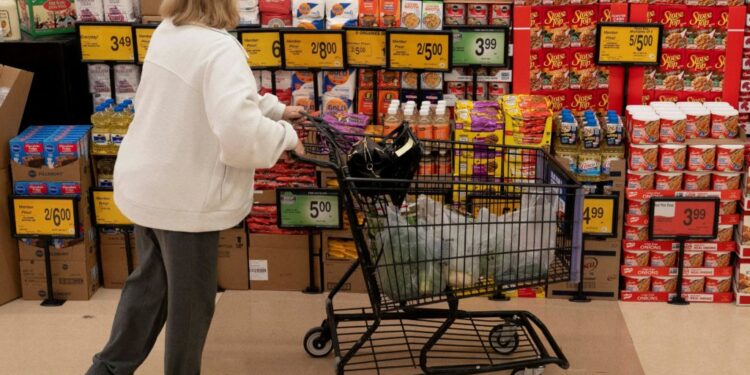 Food shoppers browse the aisles for groceries ahead of the Thanksgiving Day holiday in Redmond