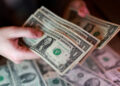 FILE PHOTO: Illustration shows U.S. dollar banknotes
