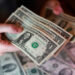 FILE PHOTO: Illustration shows U.S. dollar banknotes
