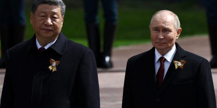 Leaders lay flowers during a ceremony on Victory Day in central Moscow