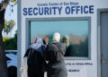 People pay their respects the morning following a shooting, at Islamic Centre of San Diego