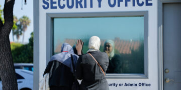 People pay their respects the morning following a shooting, at Islamic Centre of San Diego