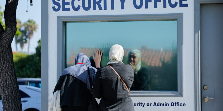 People pay their respects the morning following a shooting, at Islamic Centre of San Diego