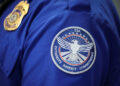 Transportation Security Administration (TSA) works during the first day of a partial U.S. government shutdown in Burbank