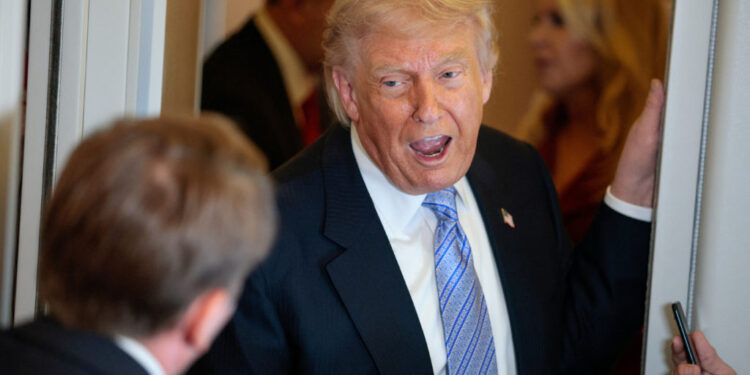 U.S. President Donald Trump speaks to members of the media on board Air Force One, following his visit to China