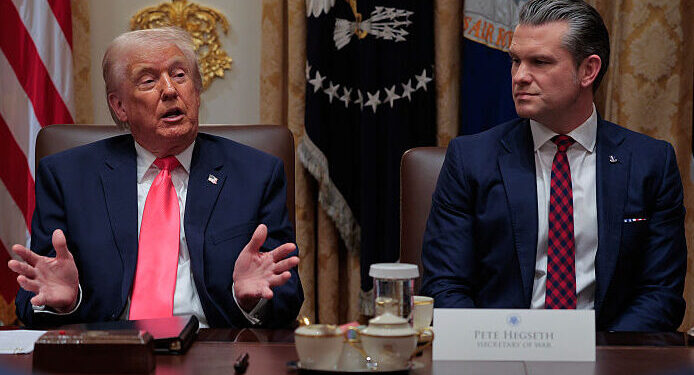 WASHINGTON, DC - DECEMBER 02: U.S. President Donald Trump (L) speaks as U.S. Secretary of War Pete Hegseth looks on during a meeting of his Cabinet in the Cabinet Room of the White House on December 02, 2025 in Washington, DC. A bipartisan Congressional investigation has begun regarding Secretary of War Pete Hegseth's role in ordering U.S. military strikes on small boats in the waters off Venezuela that have killed scores of people, which Hegseth said are intended "to stop lethal drugs, destroy narco-boats and kill the narco-terrorists who are poisoning the American people.” (Photo by Chip Somodevilla/Getty Images)