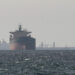 FILE PHOTO: Cargo ships in the Gulf, near the Strait of Hormuz