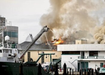 Firefighters extinguishing fire on University of South Florida campus in St. Petersburg