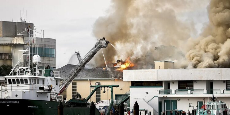 Firefighters extinguishing fire on University of South Florida campus in St. Petersburg