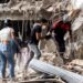 Family members and volunteers search through the rubble after two 17-story buildings in the Belo Horizonte residential complex collapsed in Catia La Mar, La Guaira (Venezuela), on June 26, 2026.