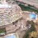 A partly collapsed building from above.