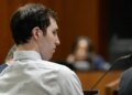 Tyler Robinson standing in a courtroom during a hearing in Provo, Utah