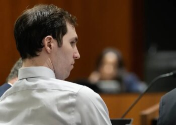 Tyler Robinson standing in a courtroom during a hearing in Provo, Utah