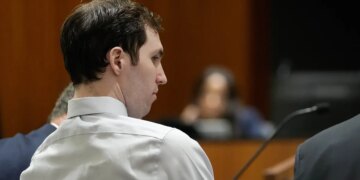Tyler Robinson standing in a courtroom during a hearing in Provo, Utah