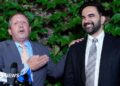 Brad Lander, candidate for New York’s 10th Congressional District, stands next to New York City Mayor Zohran Mamdani during a watch party after winning the primary elections in Brooklyn, New York