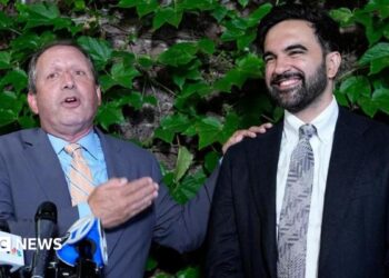 Brad Lander, candidate for New York’s 10th Congressional District, stands next to New York City Mayor Zohran Mamdani during a watch party after winning the primary elections in Brooklyn, New York