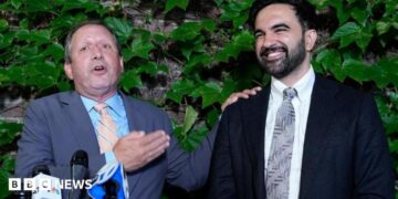 Brad Lander, candidate for New York’s 10th Congressional District, stands next to New York City Mayor Zohran Mamdani during a watch party after winning the primary elections in Brooklyn, New York