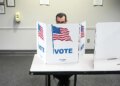 A person casting a ballot at the Fairfax Government Center in Virginia.