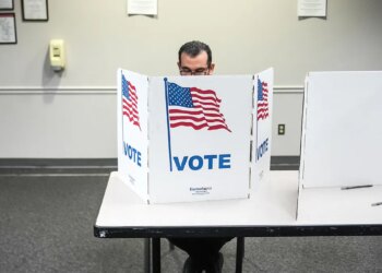 A person casting a ballot at the Fairfax Government Center in Virginia.