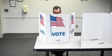 A person casting a ballot at the Fairfax Government Center in Virginia.