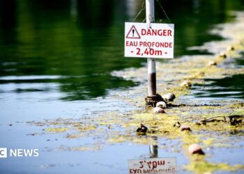 A river in France with a danger sign