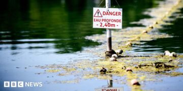 A river in France with a danger sign