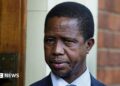 A head and shoulders image of Edgar Lungu. His  blue collar and dark jacket can just be seen at the bottom of the picture.