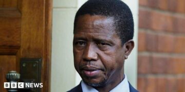 A head and shoulders image of Edgar Lungu. His  blue collar and dark jacket can just be seen at the bottom of the picture.