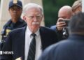 John Bolton arrives in court on Friday