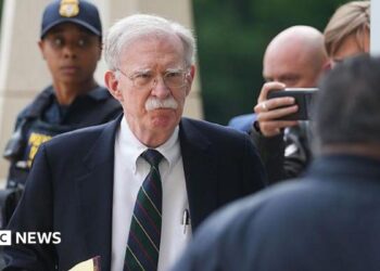 John Bolton arrives in court on Friday