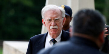 Former White House national security adviser John Bolton arrives at the U.S. District Court for the District of Maryland, ...