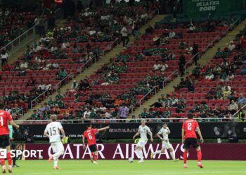 South Korea and Czech Republic play in front of a stand with a number of empty seats