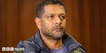 South Africa's deputy head of crime intelligence Feroz Khan is seen in court. He has short hair and a short beard