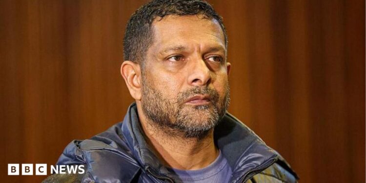 South Africa's deputy head of crime intelligence Feroz Khan is seen in court. He has short hair and a short beard