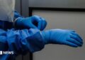 A person wearing blue protective gear