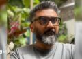 Kunal Shah, founder of Indian fintech start-up Cred, wearing a grey tee shirt and sporting sunglasses.