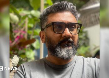 Kunal Shah, founder of Indian fintech start-up Cred, wearing a grey tee shirt and sporting sunglasses.