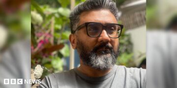 Kunal Shah, founder of Indian fintech start-up Cred, wearing a grey tee shirt and sporting sunglasses.