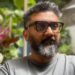 Kunal Shah, founder of Indian fintech start-up Cred, wearing a grey tee shirt and sporting sunglasses.