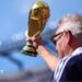 A Scotland supporter raises a replica FIFA World Cup Trophy in the stands prior to during the Group C match against Morocco