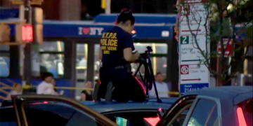 A cop on a police car in the Bronx