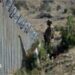 File photo of a soldier standing along the Pakistan-Afghanistan border