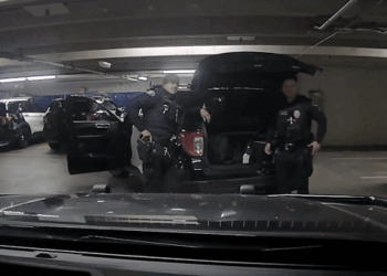 Pasadena Police Officer points gun at another officer then reholsters