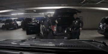 Pasadena Police Officer points gun at another officer then reholsters