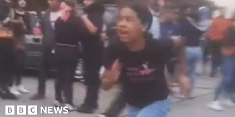 A girl runs from building damagd by earthquake in  El Junquito near Caracas