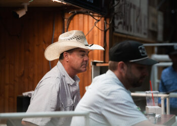 Brian Uptmore and Bodie Gist auction off cattle at the West Auction barn in West, Texas on Thursday, June 11, 2026.