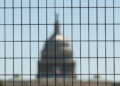 Dome of the U.S. Capitol seen through construction fencing as preparations for Freedom 250 continue along the National Mal...