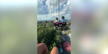 Recording of a person stuck on a ride.