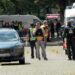 Crowds of emergency workers stand in the road following a shooting in Stade, northern Germany.