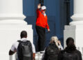 U.S. President Donald Trump waves as he returns to the White House, in Washington